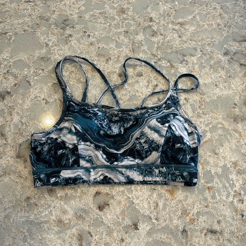 Gaian Yoga sports bra. Medium crossed straps in back. Blue, aqua white swirl.